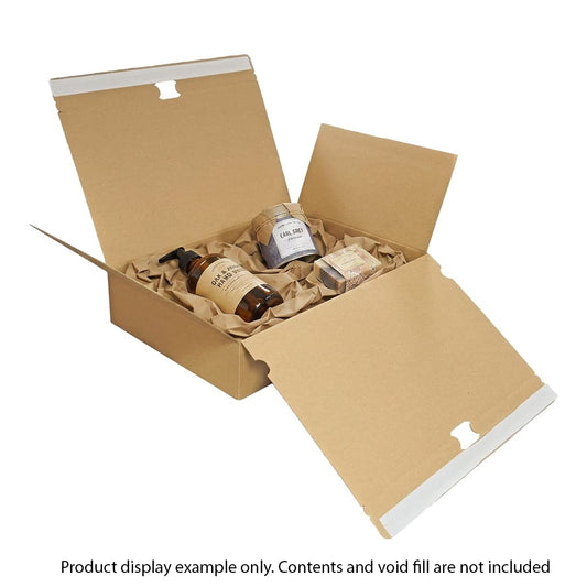 Open cardboard box with bath products on a white background
