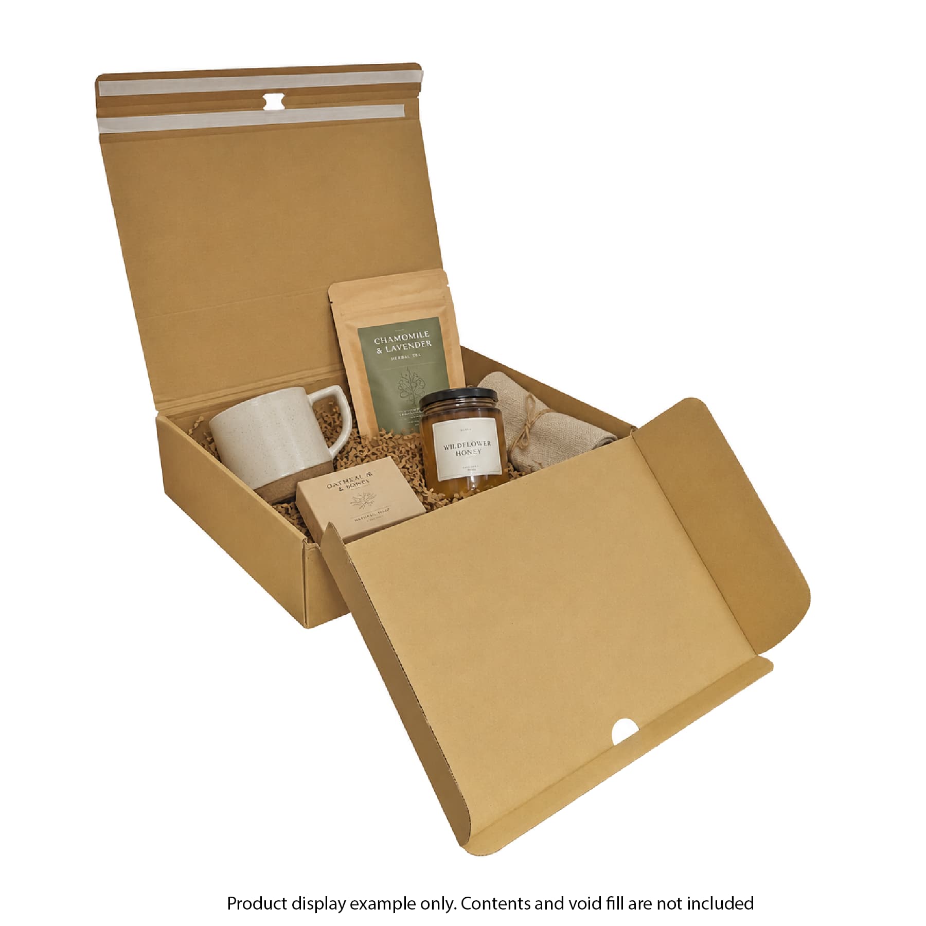 Open cardboard box with a mug, jar, and other items on a white background