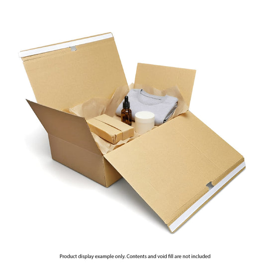 Open cardboard box with various items on a white background